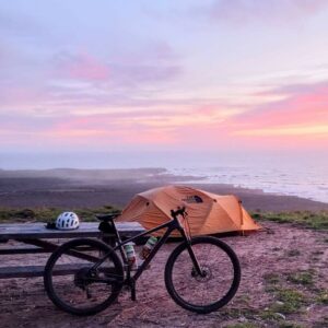 Bicycle camping at sunset